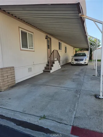 a view of garage with parked cars