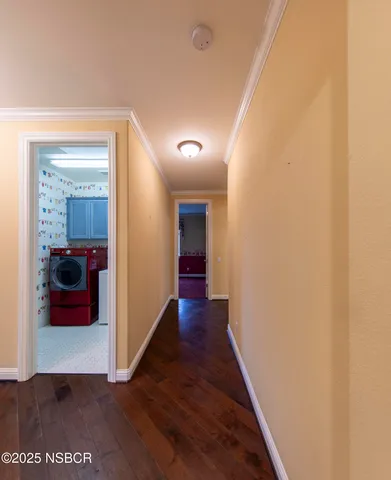 a view of a hallway view with wooden floor and staircase
