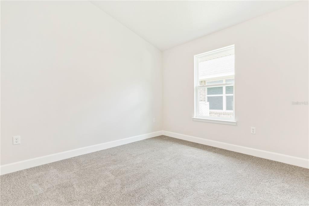 90 Rivertown Road Palm Coast, FL 32137 - Photo 47 of 60 an empty room with a window