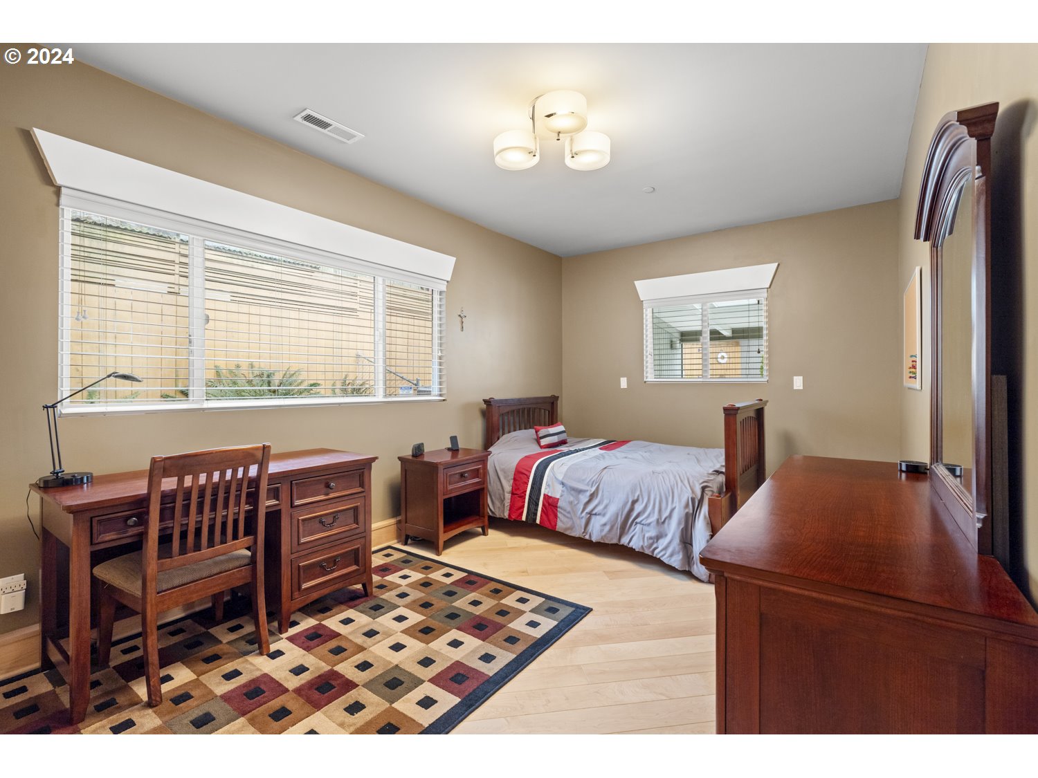 8857 Southwest Edgewood Street Tigard, OR 97223 - Photo 31 of 48 a bedroom with furniture and a window