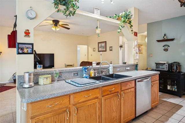 a spacious bathroom with a granite countertop sink and a mirror