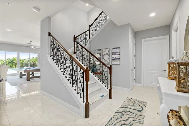 a view of an entryway with wooden floor