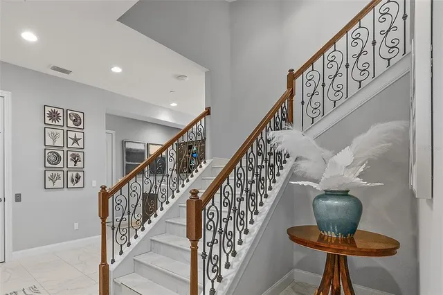 a spacious bedroom with a bed and a window