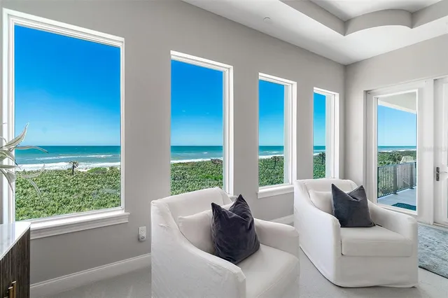 a table and chairs with the view of balcony