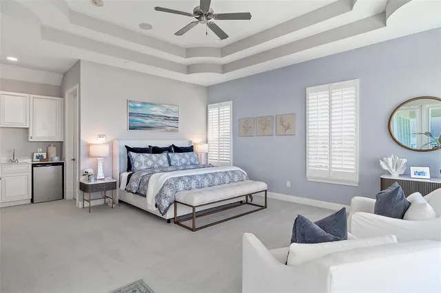 a view of a dining room with furniture large windows and wooden floor