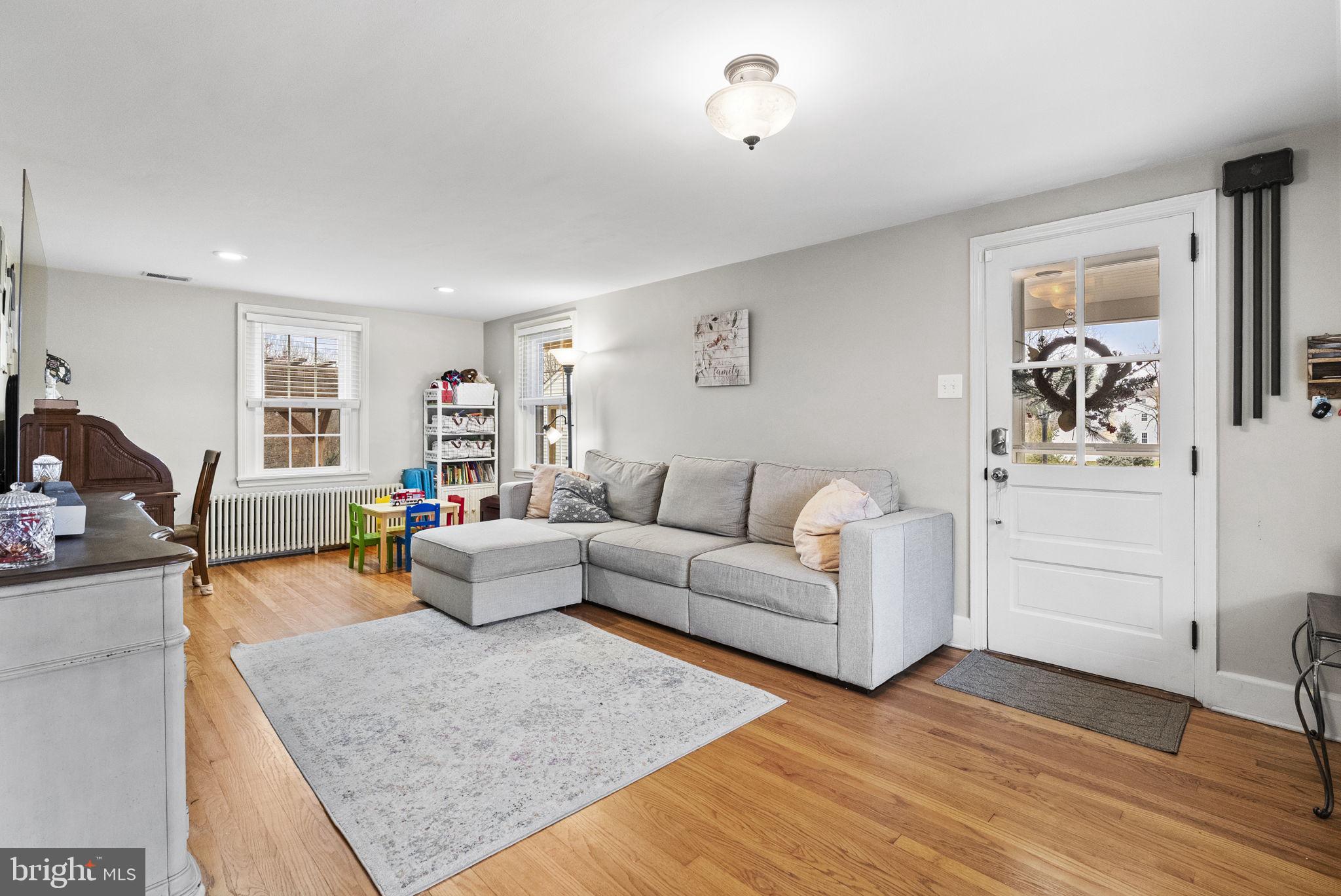 1776 West Doe Run Road Kennett Square, PA 19348 - Photo 11 of 34 a living room with furniture and a wooden floor