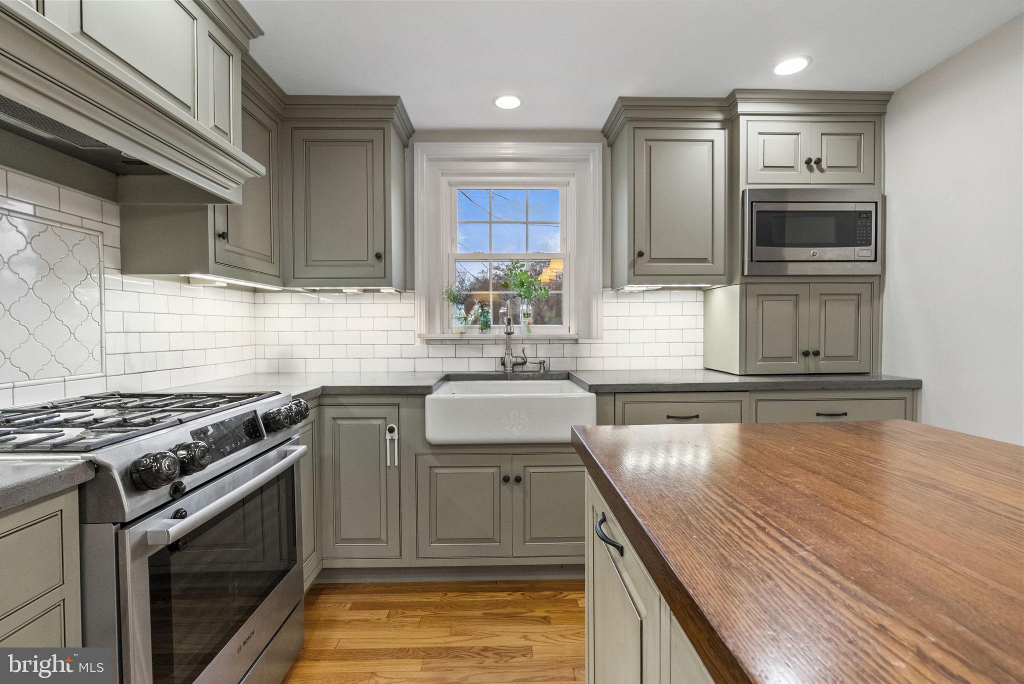 1776 West Doe Run Road Kennett Square, PA 19348 - Photo 19 of 34 a kitchen with kitchen island granite countertop a sink cabinets and stainless steel appliances