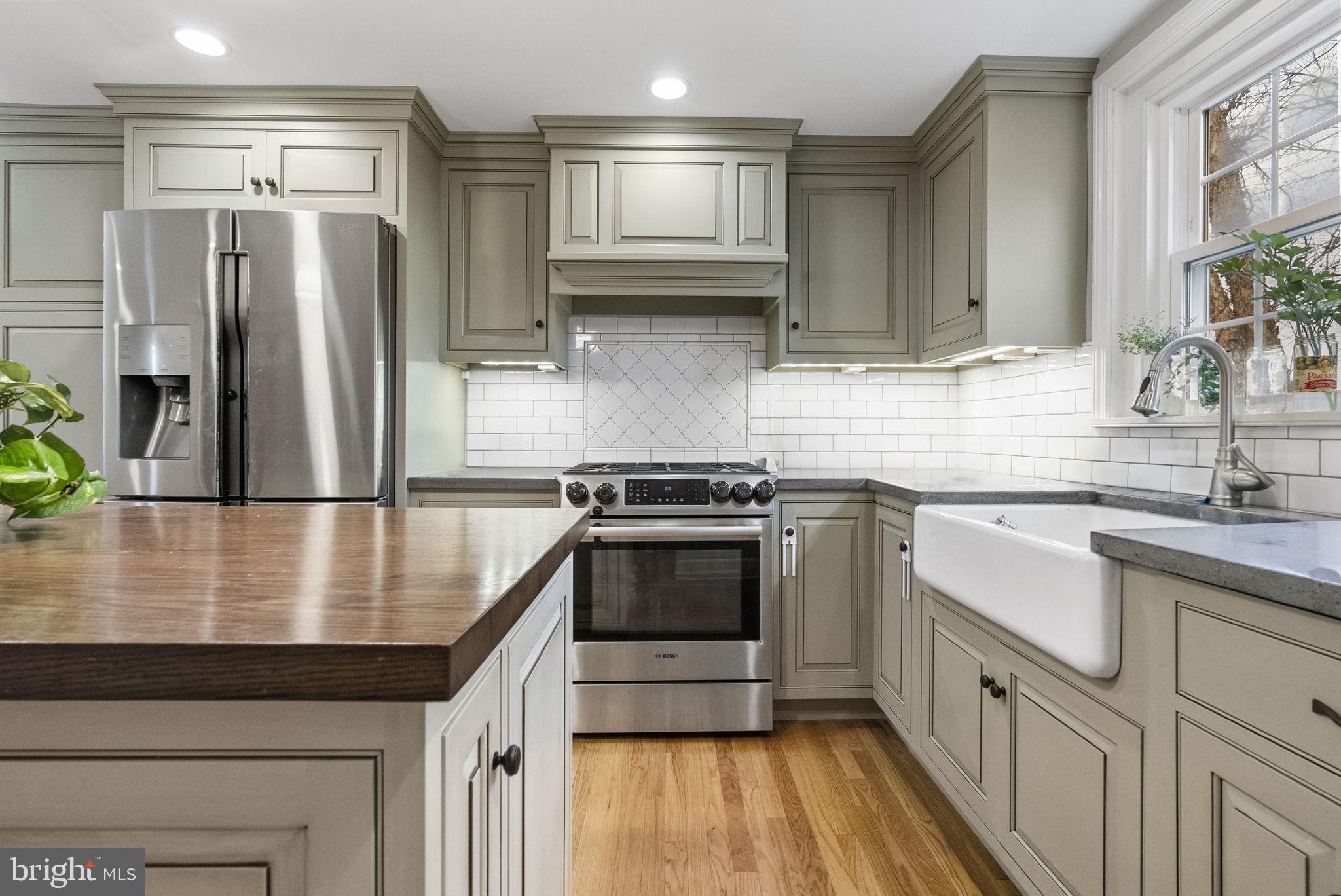 1776 West Doe Run Road Kennett Square, PA 19348 - Photo 20 of 34 a kitchen with stainless steel appliances granite countertop a sink a stove and a refrigerator