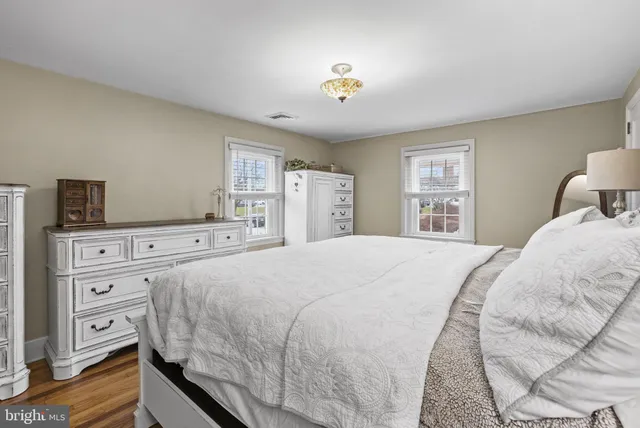 a bedroom with a bed and a tv