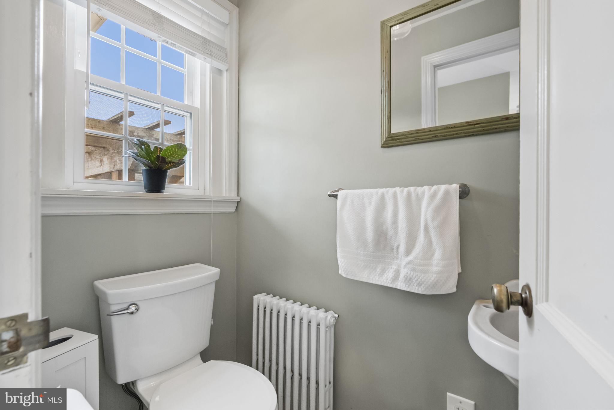 1776 West Doe Run Road Kennett Square, PA 19348 - Photo 27 of 34 a white toilet sitting next to a bathroom sink