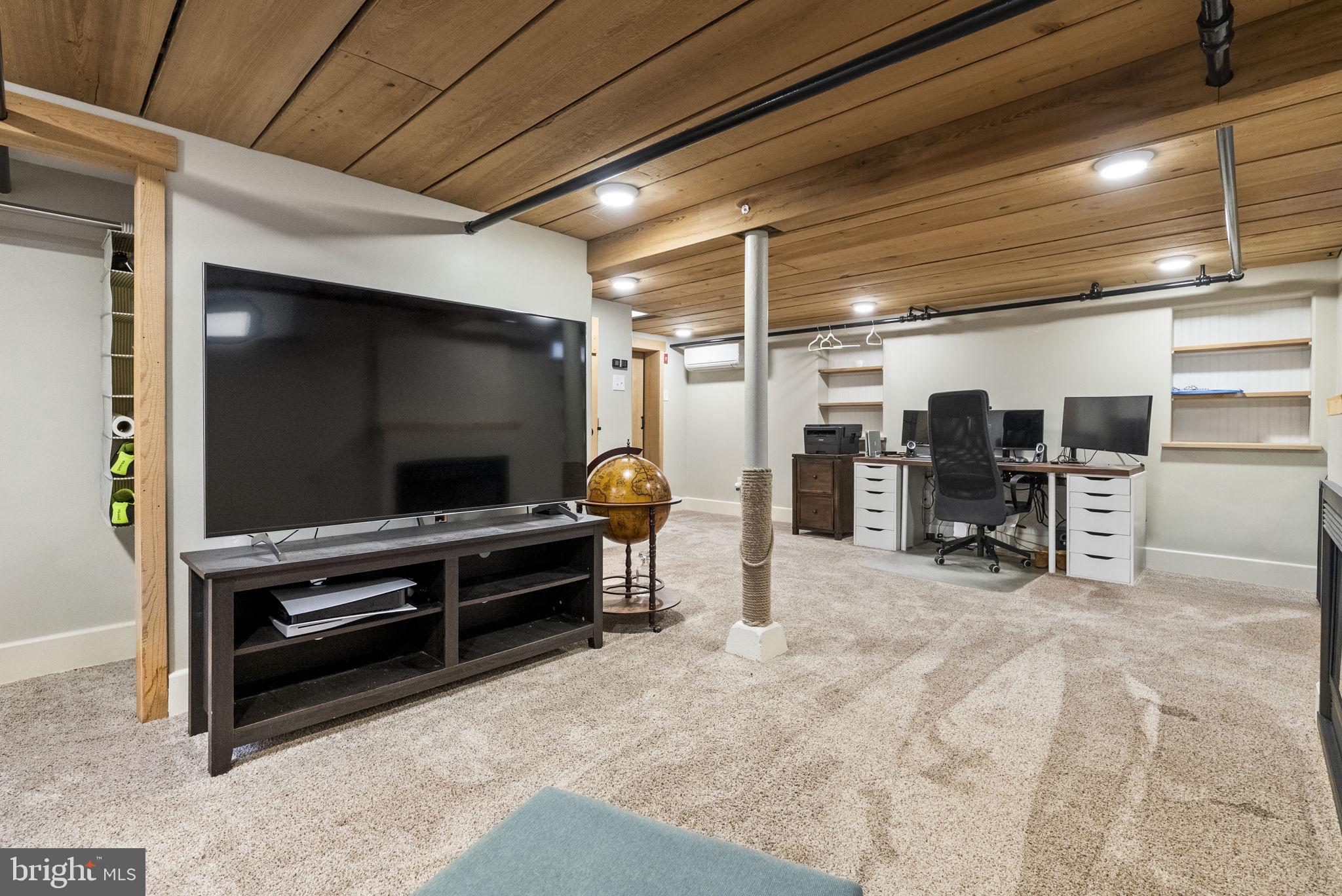 1776 West Doe Run Road Kennett Square, PA 19348 - Photo 29 of 34 a living room with a flat screen tv and chairs