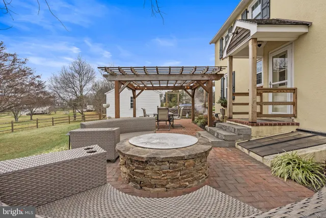 a view of a couches and dinning table and chair in the patio