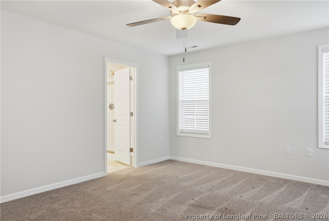 106 Knotts Berry Road Bunnlevel, NC 28323 - Photo 23 of 50 an empty room with a window and a fan