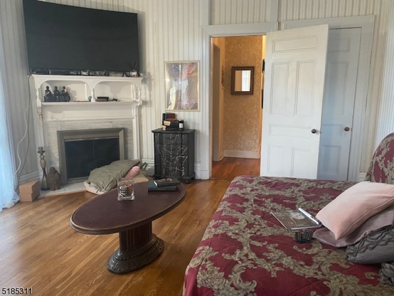 527 West 8th Street, Unit B Plainfield, NJ 07060 - Photo 17 of 30 a living room with furniture and a fireplace
