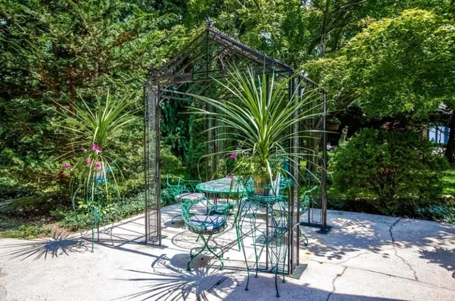 a view of a backyard with sitting area