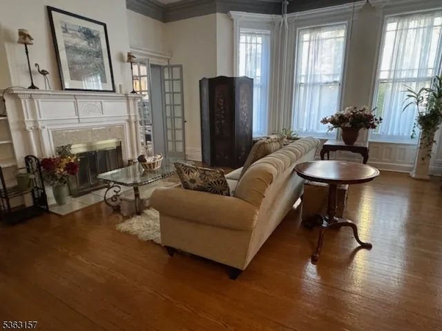 a living room with furniture and a large mirror