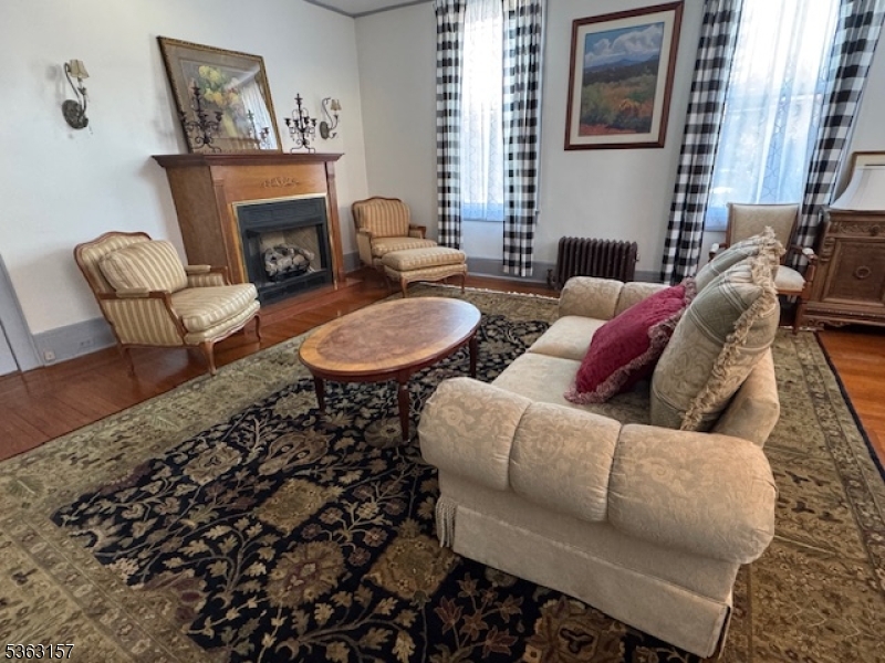 527 West 8th Street, Unit B Plainfield, NJ 07060 - Photo 9 of 30 a living room with furniture and a fireplace