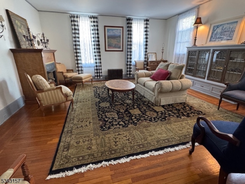 527 West 8th Street, Unit B Plainfield, NJ 07060 - Photo 10 of 30 a living room with furniture and wooden floor