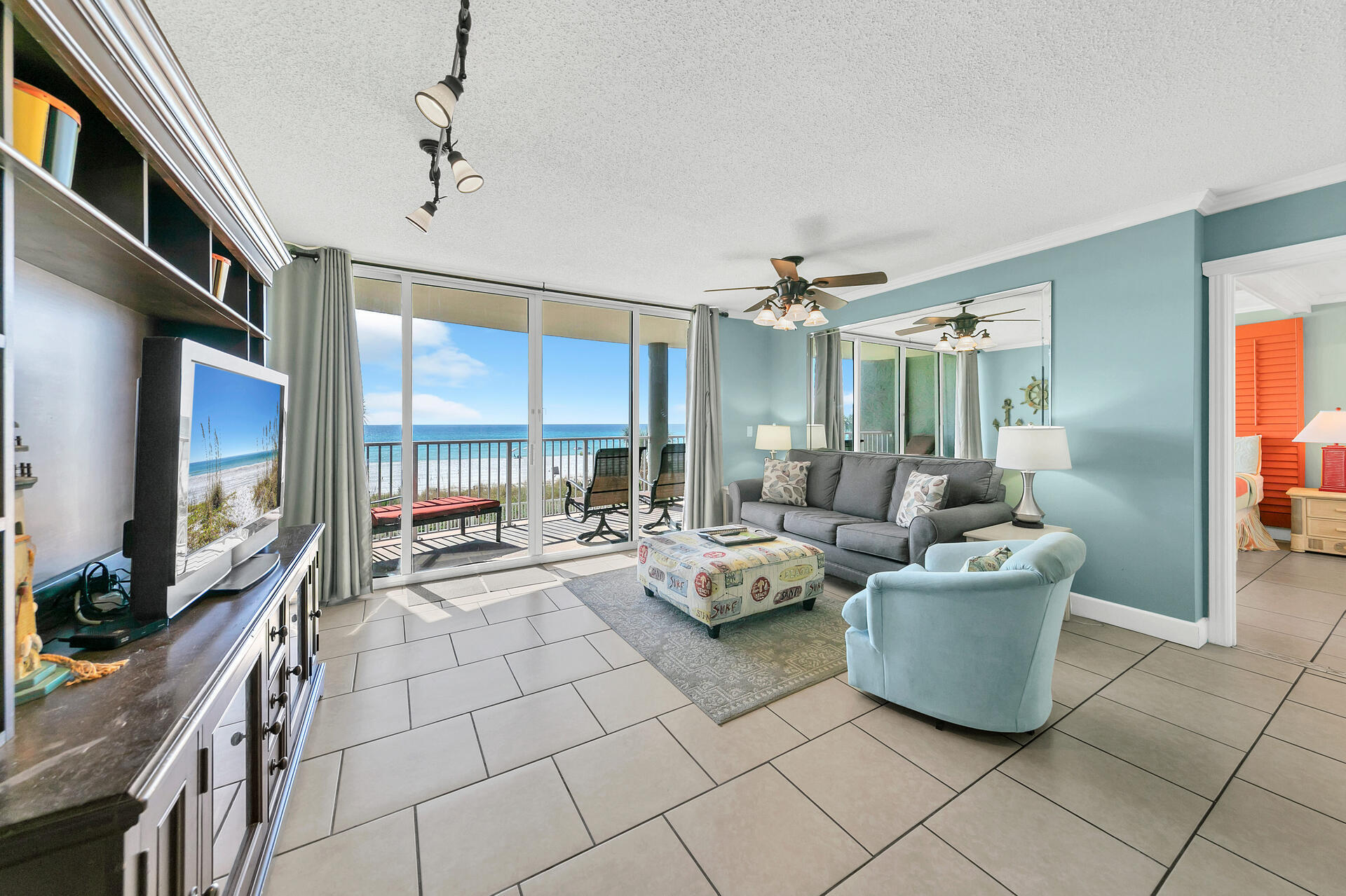 10515 Front Beach Road, Unit 102 Panama City Beach, FL 32407 - Photo 1 of 19 a living room with furniture and a large window