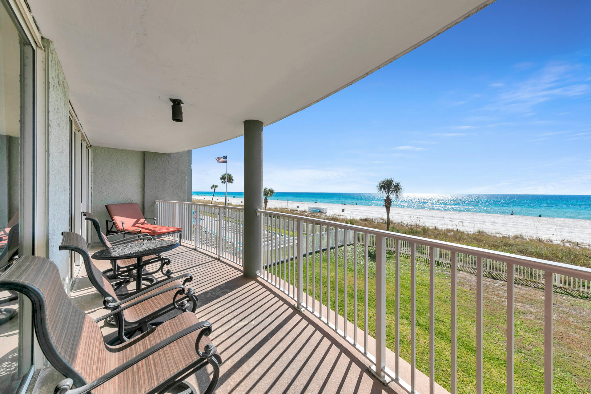 10515 Front Beach Road, Unit 102 Panama City Beach, FL 32407 - Photo 16 of 19 a view of a balcony with chairs