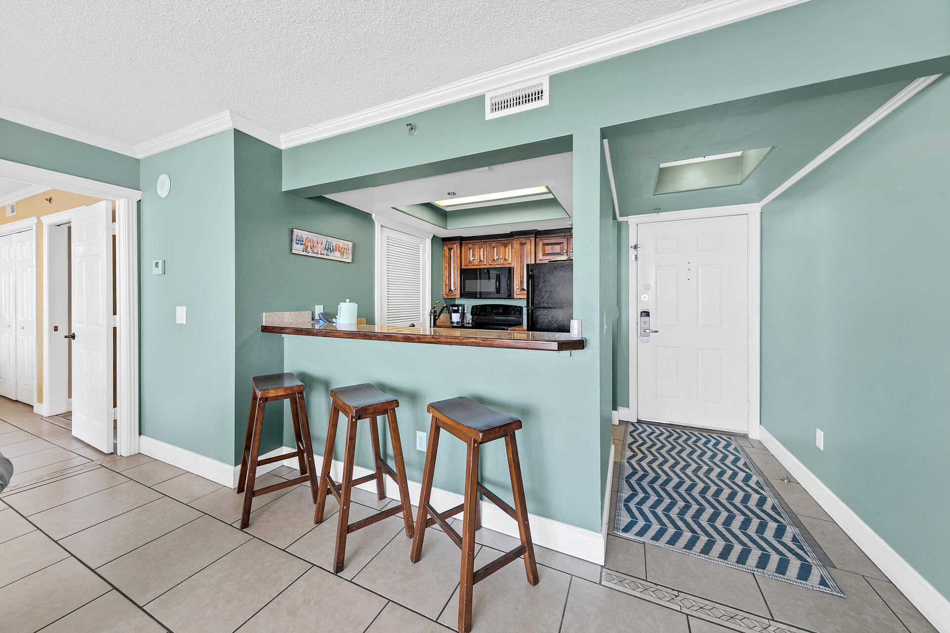 10515 Front Beach Road, Unit 102 Panama City Beach, FL 32407 - Photo 4 of 19 a dining room with furniture and window