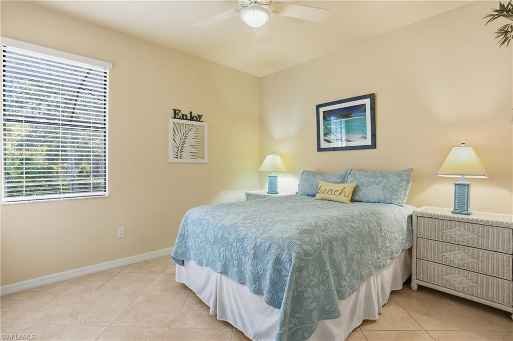3915 Treasure Cove Circle Naples, FL 34114 - Photo 18 of 24 Bedroom featuring a ceiling fan and light tile patterned floors