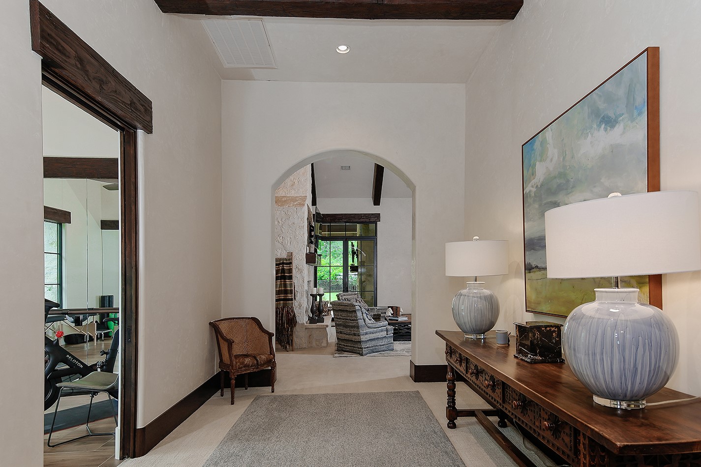 40693 Center Hill Road Hempstead, TX 77445 - Photo 11 of 50 The entry to the luxurious primary suite. The walls and ceilings are Segreto plaster giving a rustic elegance to the home.
