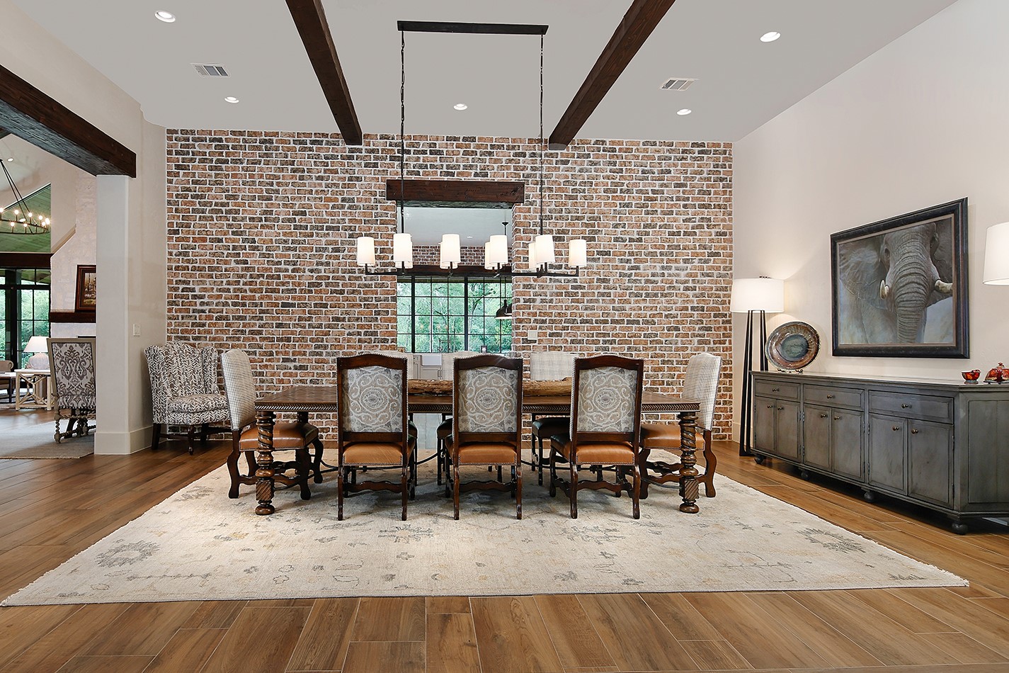 40693 Center Hill Road Hempstead, TX 77445 - Photo 22 of 50 The great room flows into the dining room featuring a brick accent wall and modern lighting.