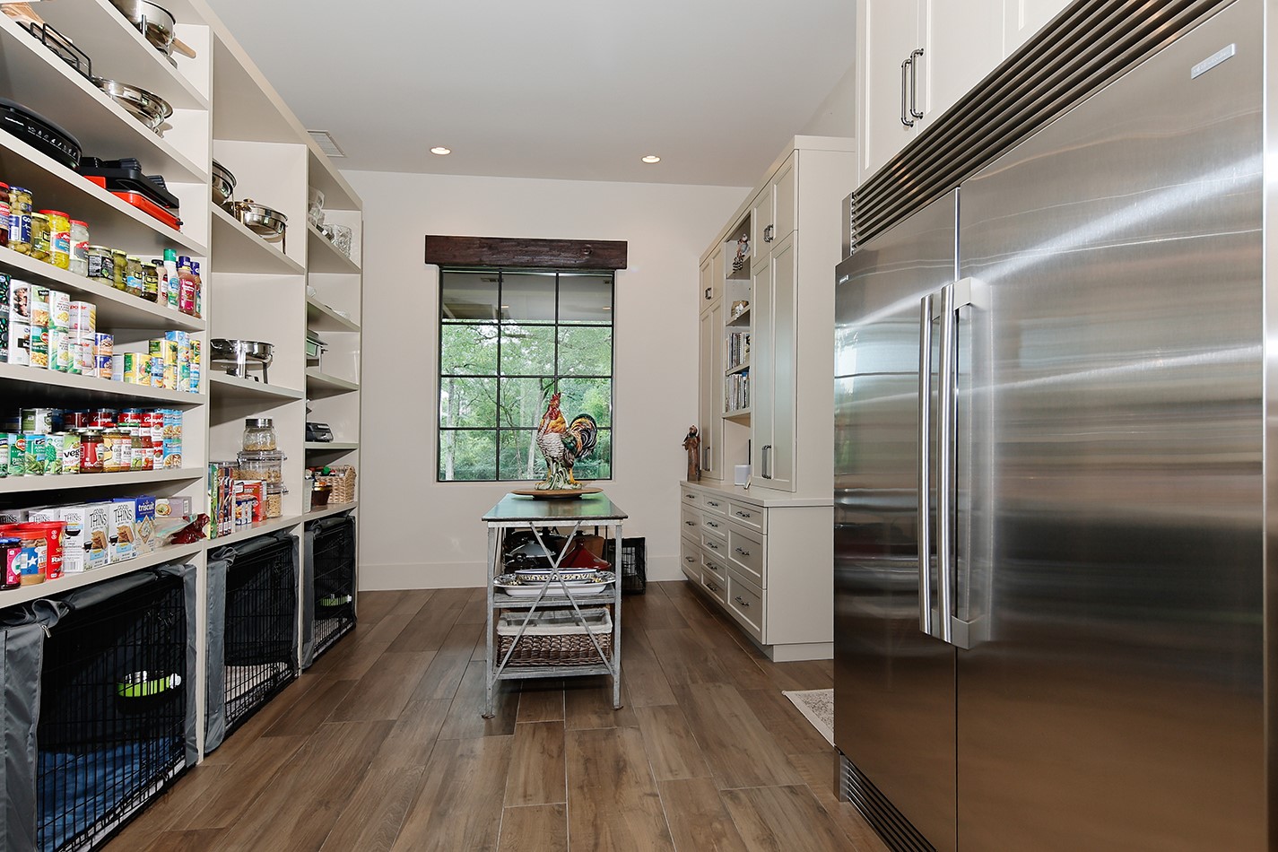 40693 Center Hill Road Hempstead, TX 77445 - Photo 28 of 50 The Caterers kitchen! Electrolux double wide refrigerator, plenty of shelving for serving dishes and open shelving for pantry staples.