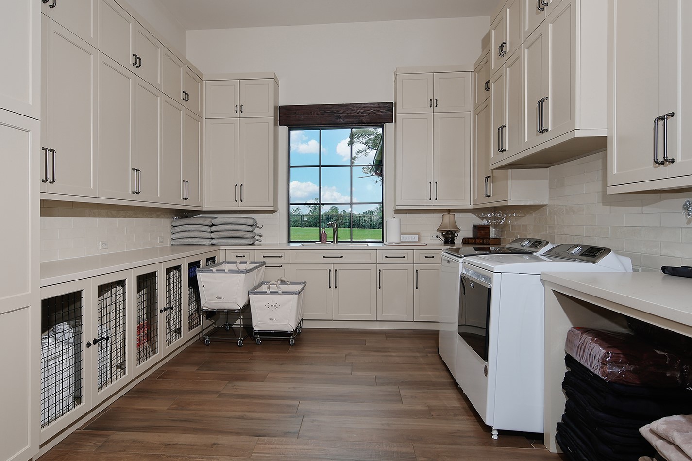 40693 Center Hill Road Hempstead, TX 77445 - Photo 30 of 50 Enter through pocket doors from the caterers kitchen to the laundry room. A large sink for hand washing, plenty of countertop space for folding and loads of cabinet and drawer storage.