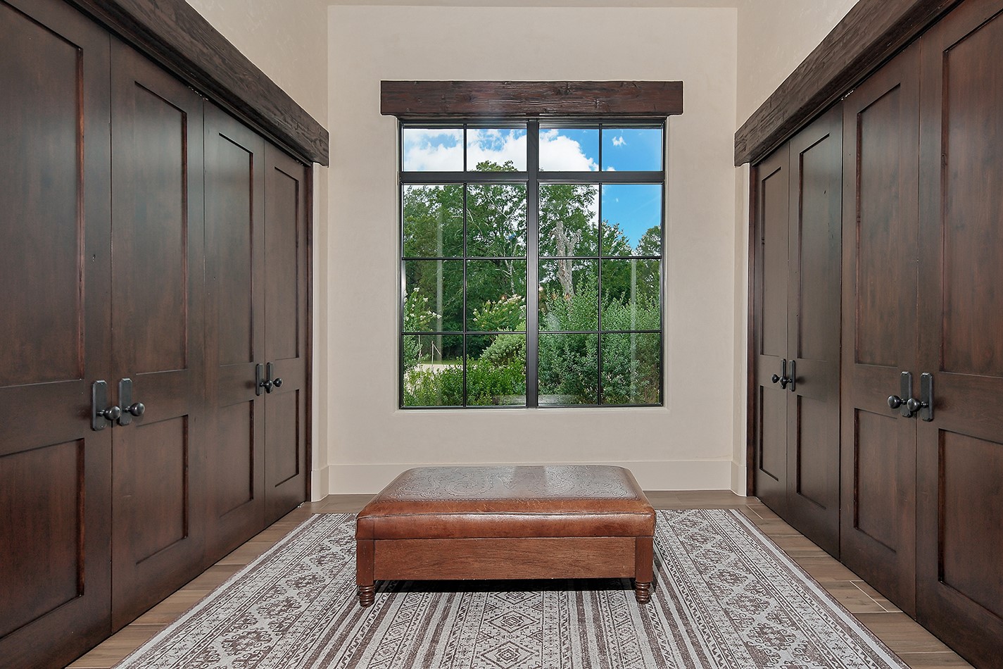 40693 Center Hill Road Hempstead, TX 77445 - Photo 31 of 50 Perfect for large parties these Bi-fold Custom doors open to closet space to accommodate your guests coats. This area is located next to a luxurious powder bath for guests off the entry.