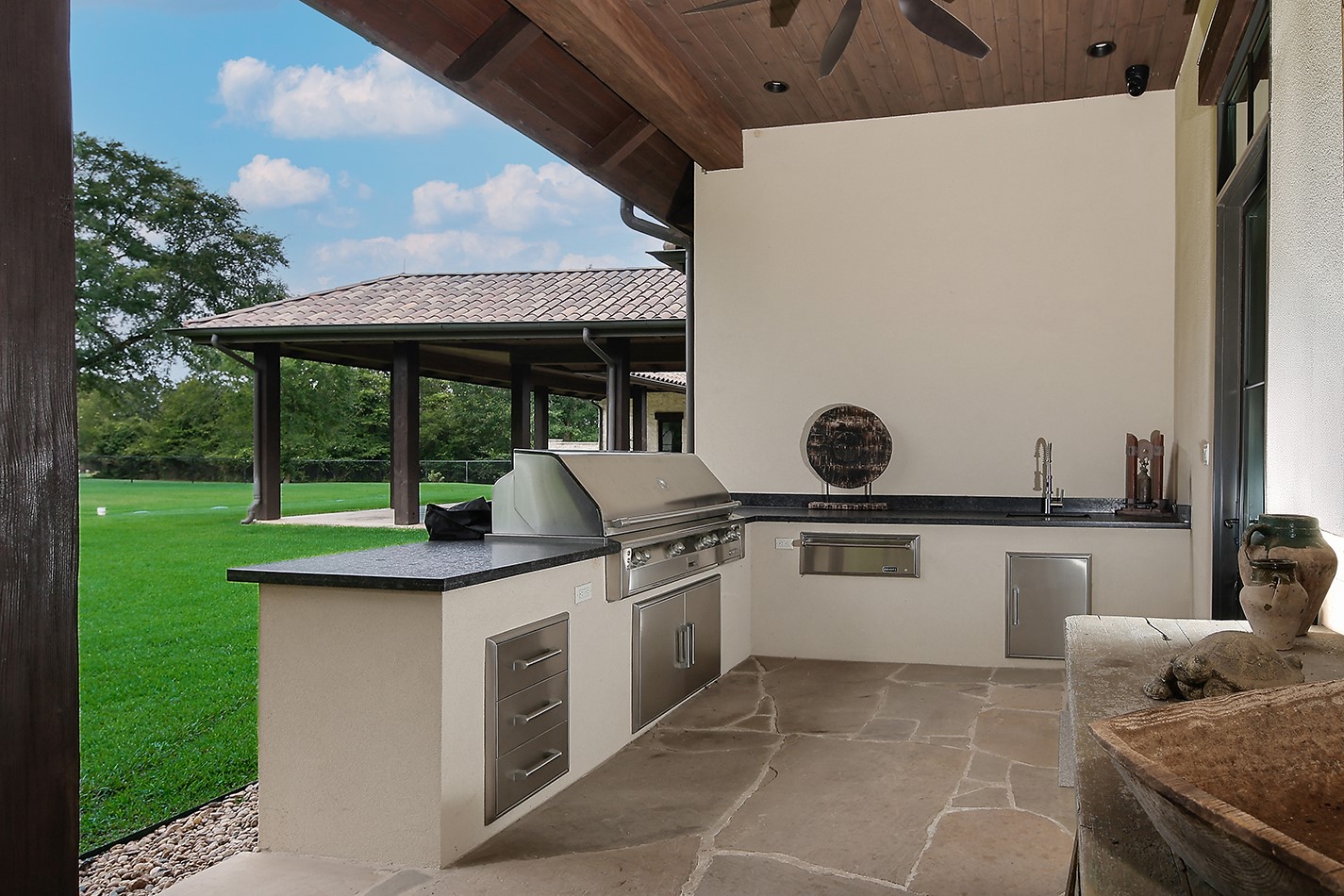 40693 Center Hill Road Hempstead, TX 77445 - Photo 37 of 50 Perfect for the bar b que enthusiast, this outdoor kitchen is complete with grill, warming drawer, sink, storage and plenty of countertop space.