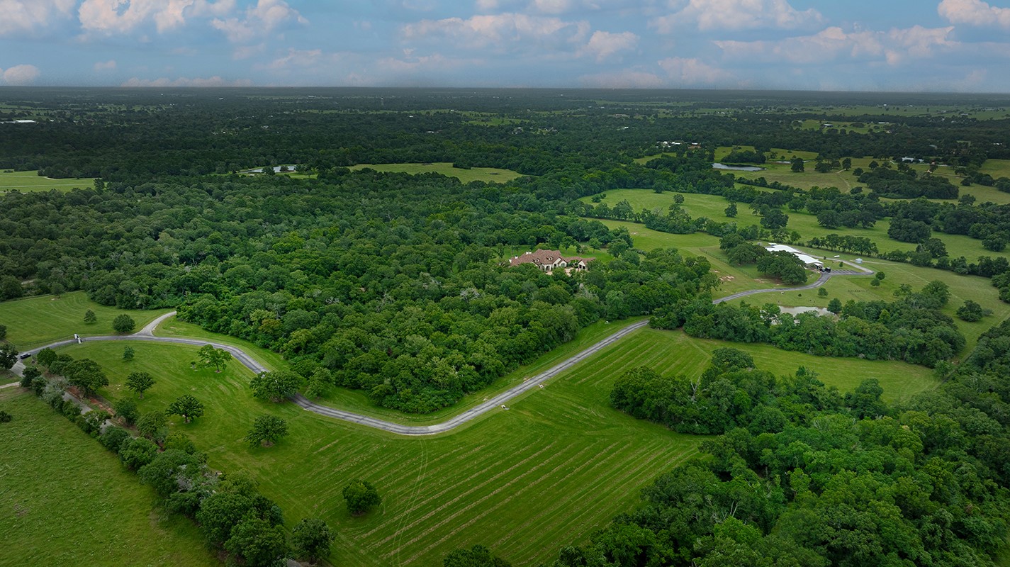 40693 Center Hill Road Hempstead, TX 77445 - Photo 40 of 50 An aerial view showing the beauty of this one of a kind estate. In addition to the gated entry a perimeter fence is 7 feet tall and buried into the ground to keep out annoying critters and to provide additional security.