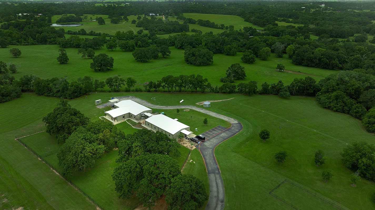 40693 Center Hill Road Hempstead, TX 77445 - Photo 44 of 50 This multi purpose commercial building is totally self contained with its own driveway from the entry gates. Ample parking and a total of 7720 sq ft the possibilities are endless. Convert to an Equestrian facility private or commercial, a recording studio or a home for your private car collection. The building has its own generator, well and septic.