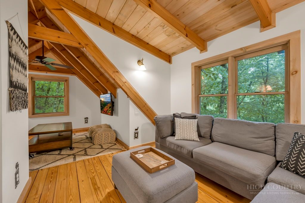 192 Dewitt Barnett Road Vilas, NC 28692 - Photo 22 of 32 a living room with furniture and a large window