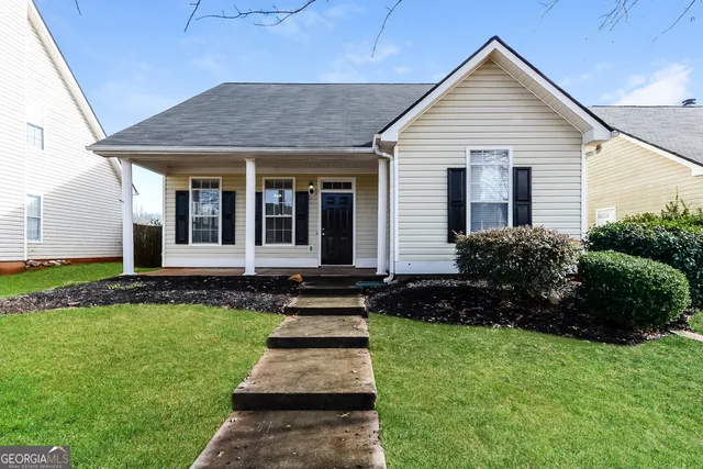 a front view of a house with a yard