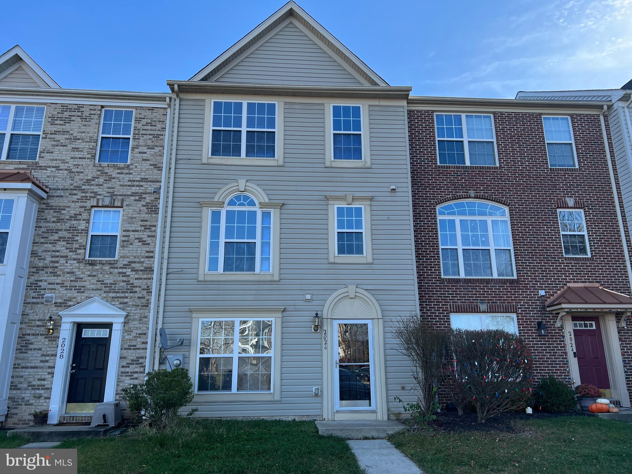 2026 Weitzel Court Frederick, MD 21702 - Photo 1 of 30 a front view of a house with garden