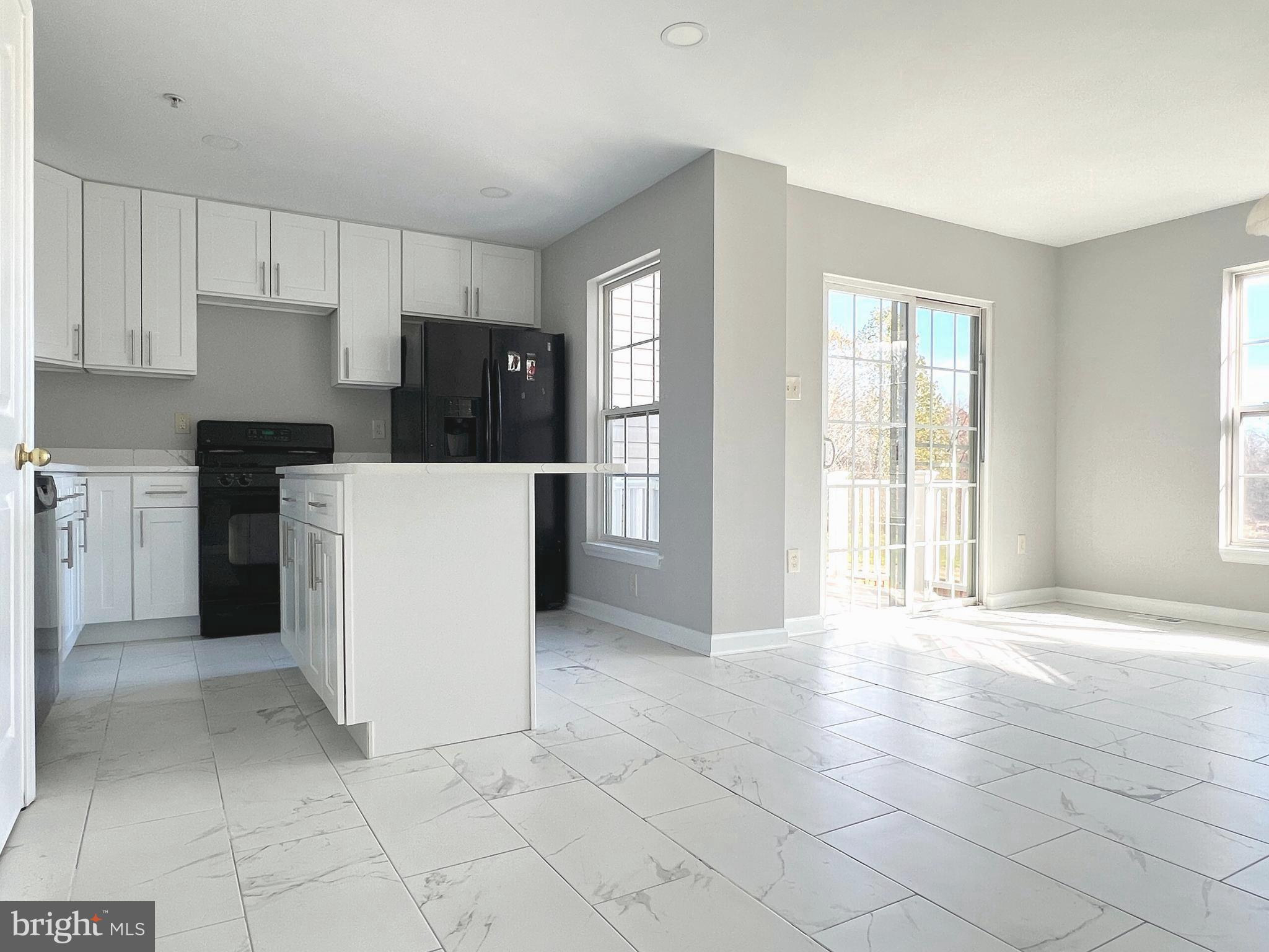 2026 Weitzel Court Frederick, MD 21702 - Photo 11 of 30 a view of a kitchen with electric appliances