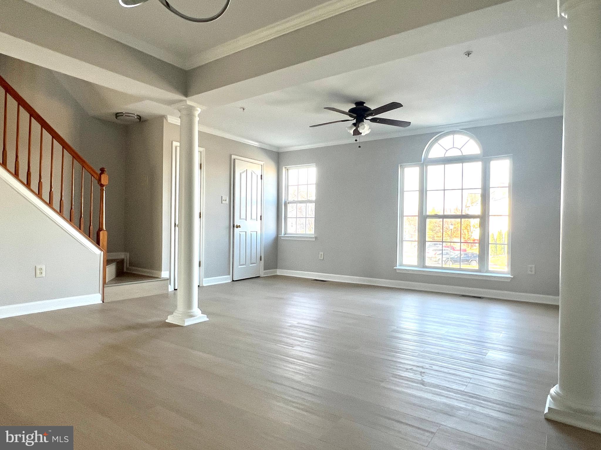2026 Weitzel Court Frederick, MD 21702 - Photo 14 of 30 a view of an empty room with a window and wooden floor