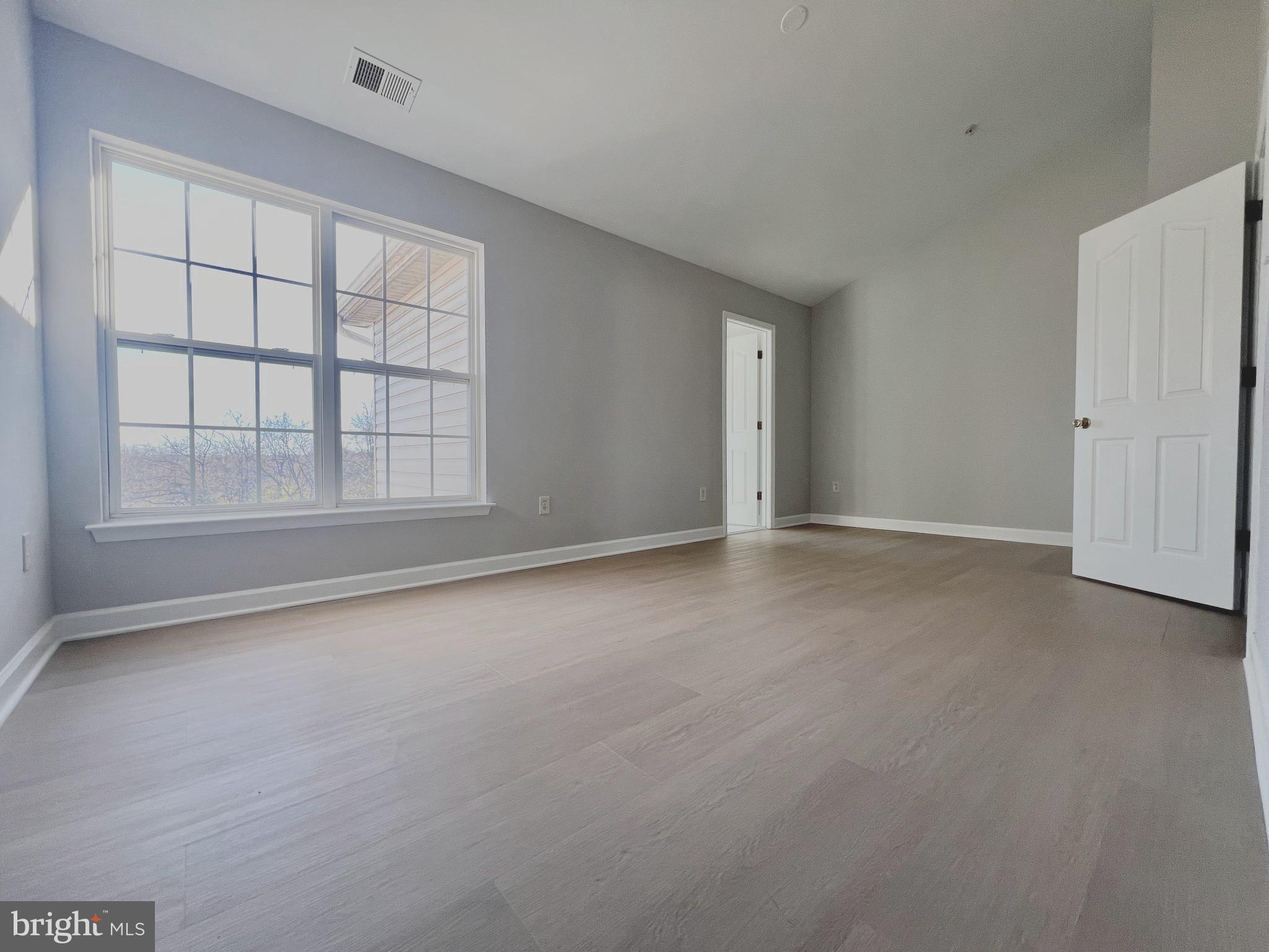 2026 Weitzel Court Frederick, MD 21702 - Photo 17 of 30 an empty room with windows and closet