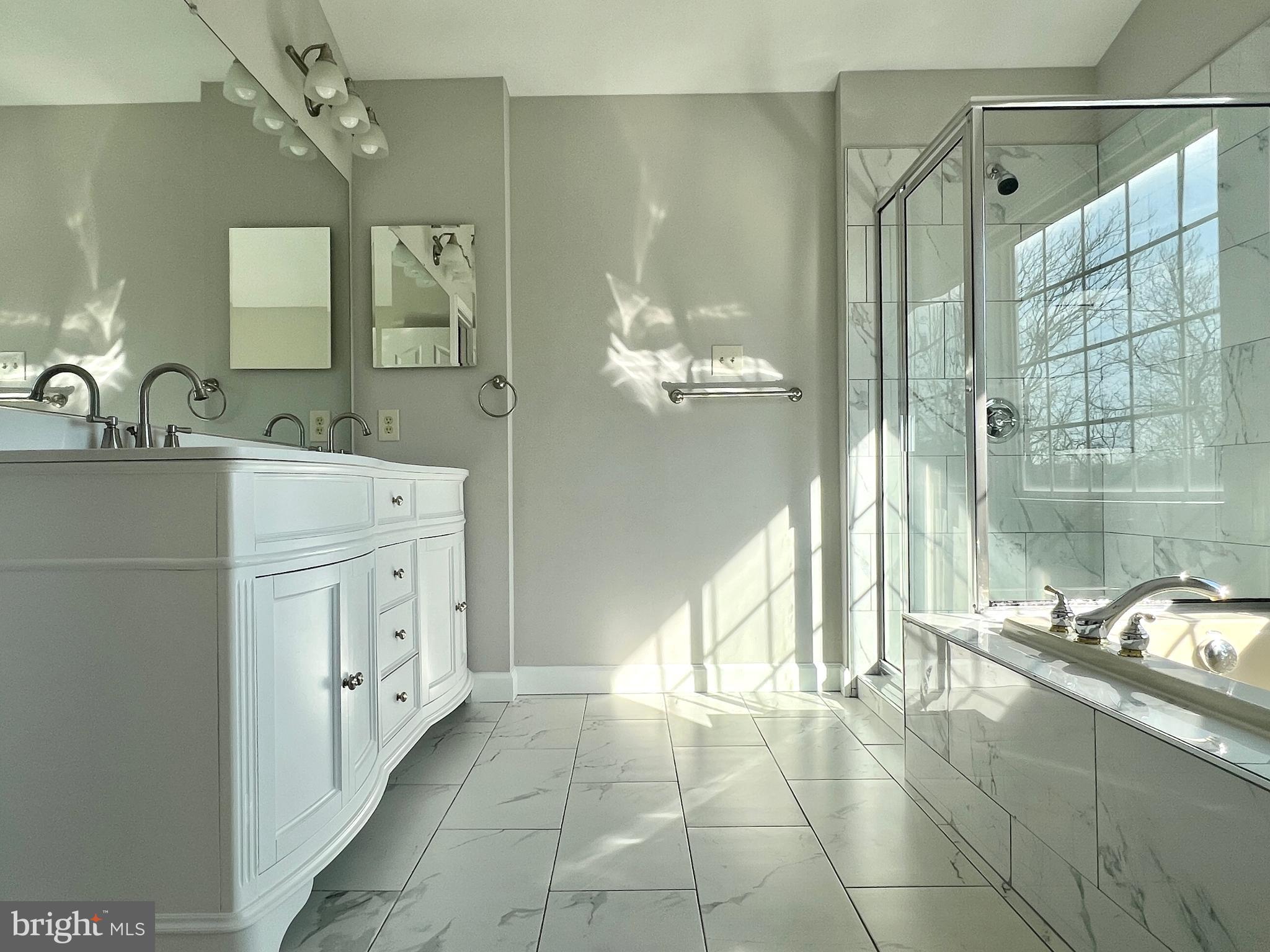 2026 Weitzel Court Frederick, MD 21702 - Photo 20 of 30 a bathroom with a sink a granite counter and a mirror