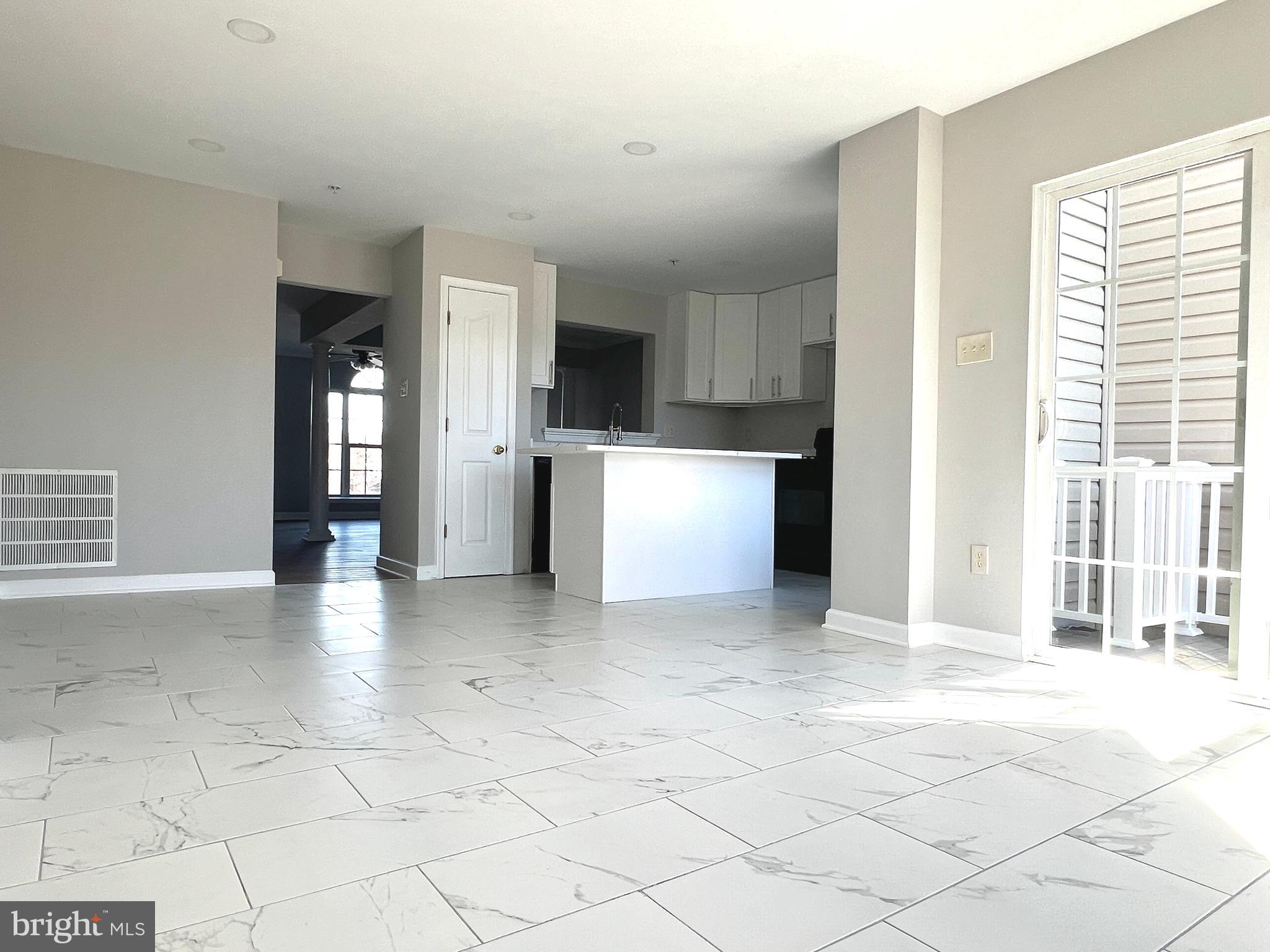 2026 Weitzel Court Frederick, MD 21702 - Photo 10 of 30 a view of an empty room with a kitchen