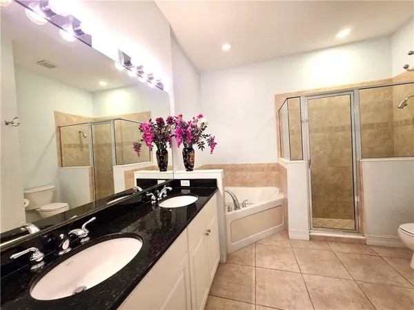 a bathroom with a sink a vanity and a mirror