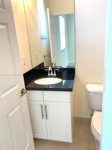 a bathroom with a sink and a toilet