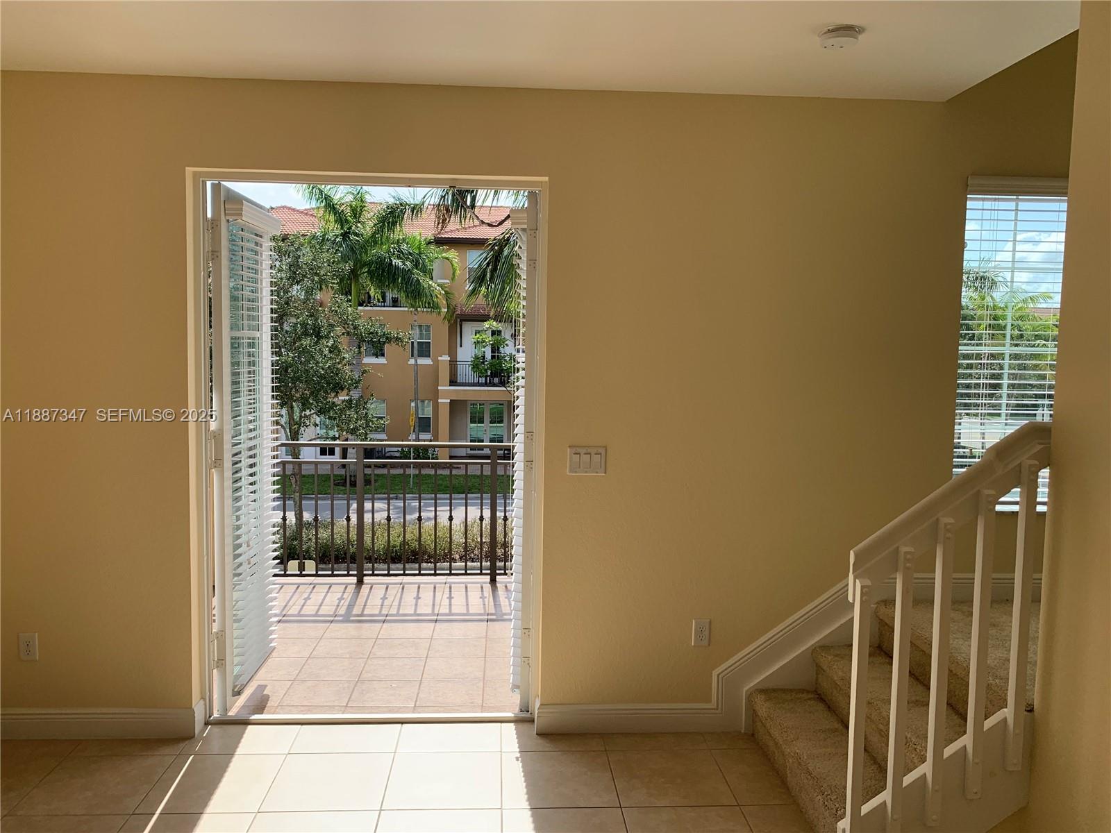 1044 Southwest 147th Avenue, Unit 10105 Pembroke Pines, FL 33027 - Photo 13 of 23 a view of entryway and hall with wooden floor