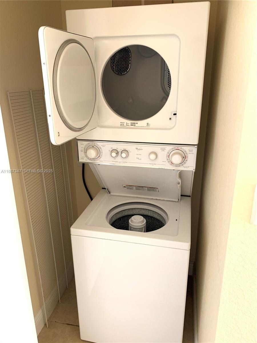 1044 Southwest 147th Avenue, Unit 10105 Pembroke Pines, FL 33027 - Photo 23 of 23 a close up view of washer and dryer