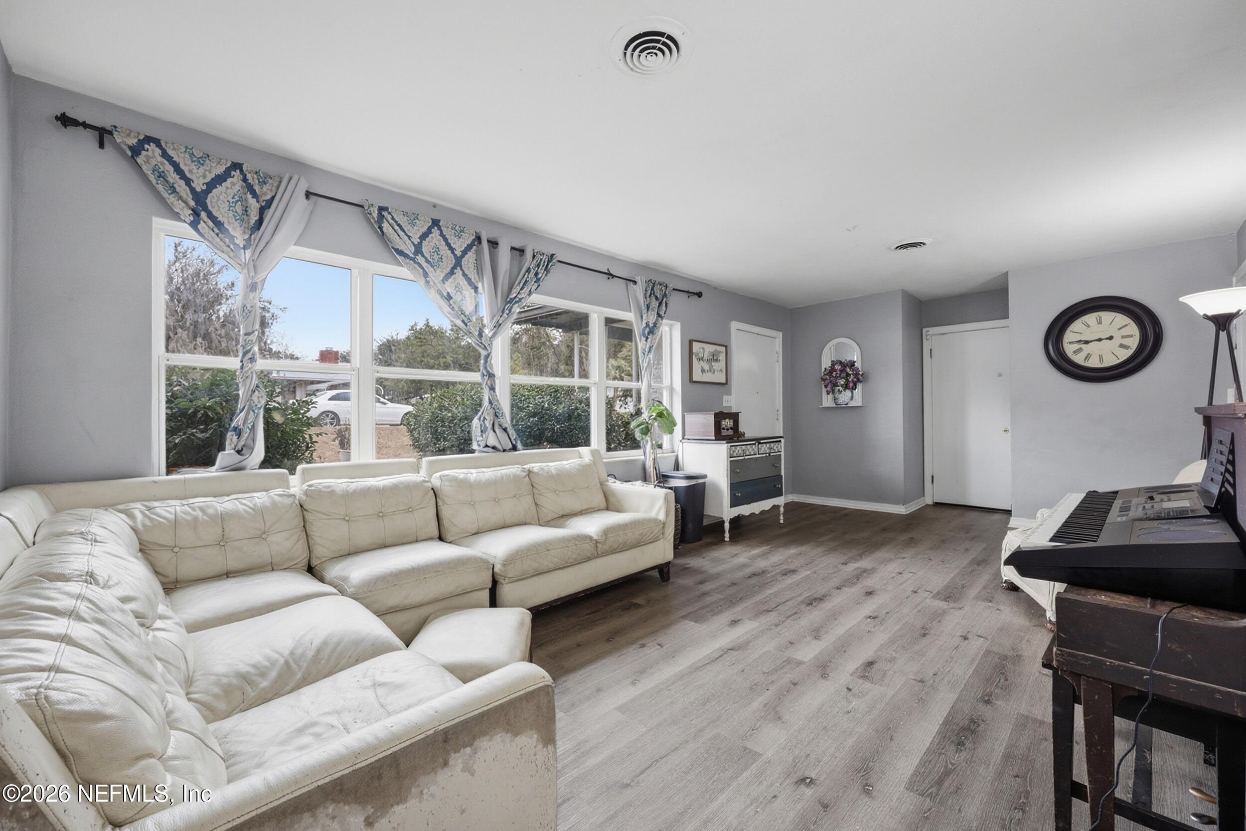 101 Cedar Street Palatka, FL 32177 - Photo 13 of 43 a living room with furniture and a window