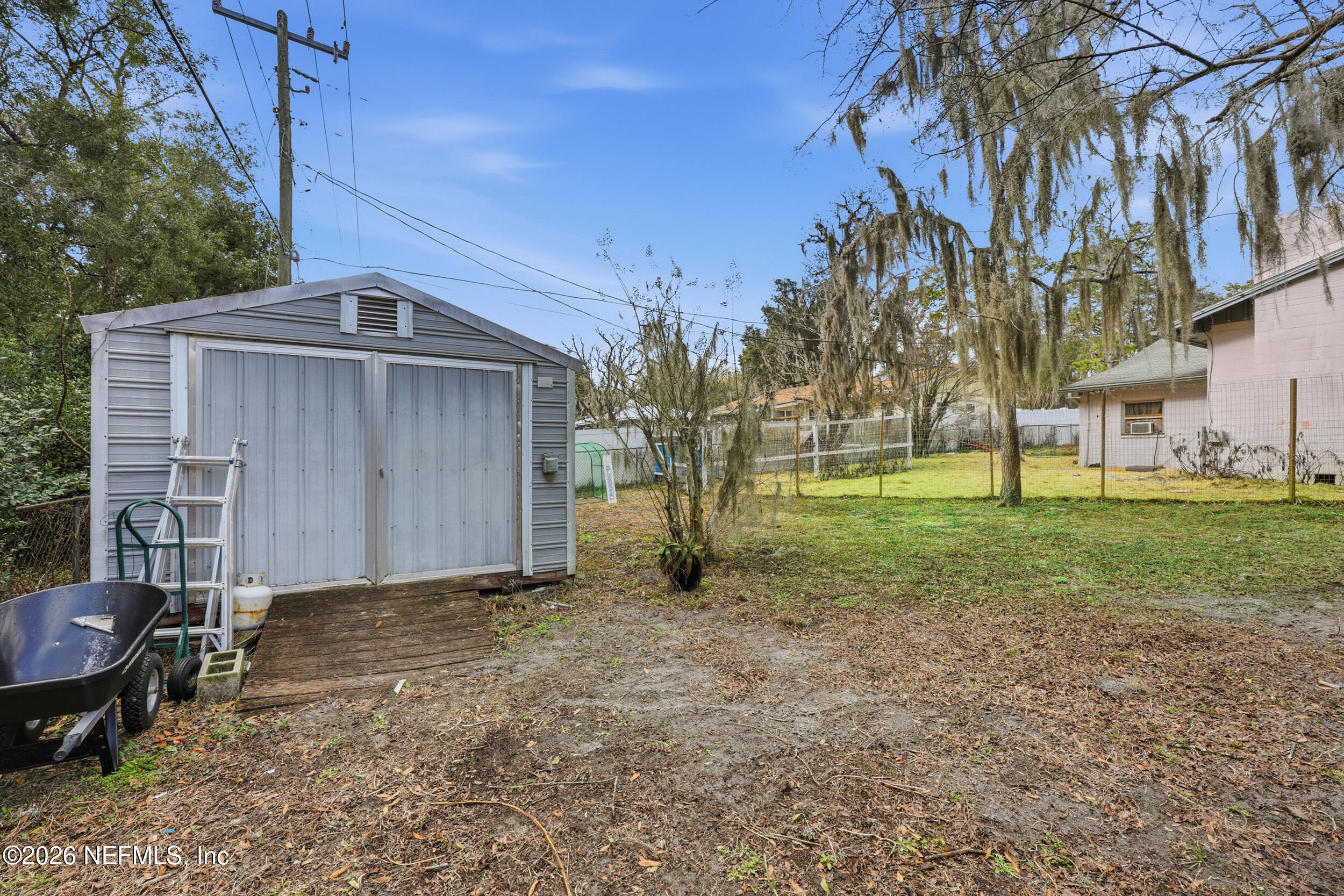 101 Cedar Street Palatka, FL 32177 - Photo 27 of 43 a view of a house with backyard and trees