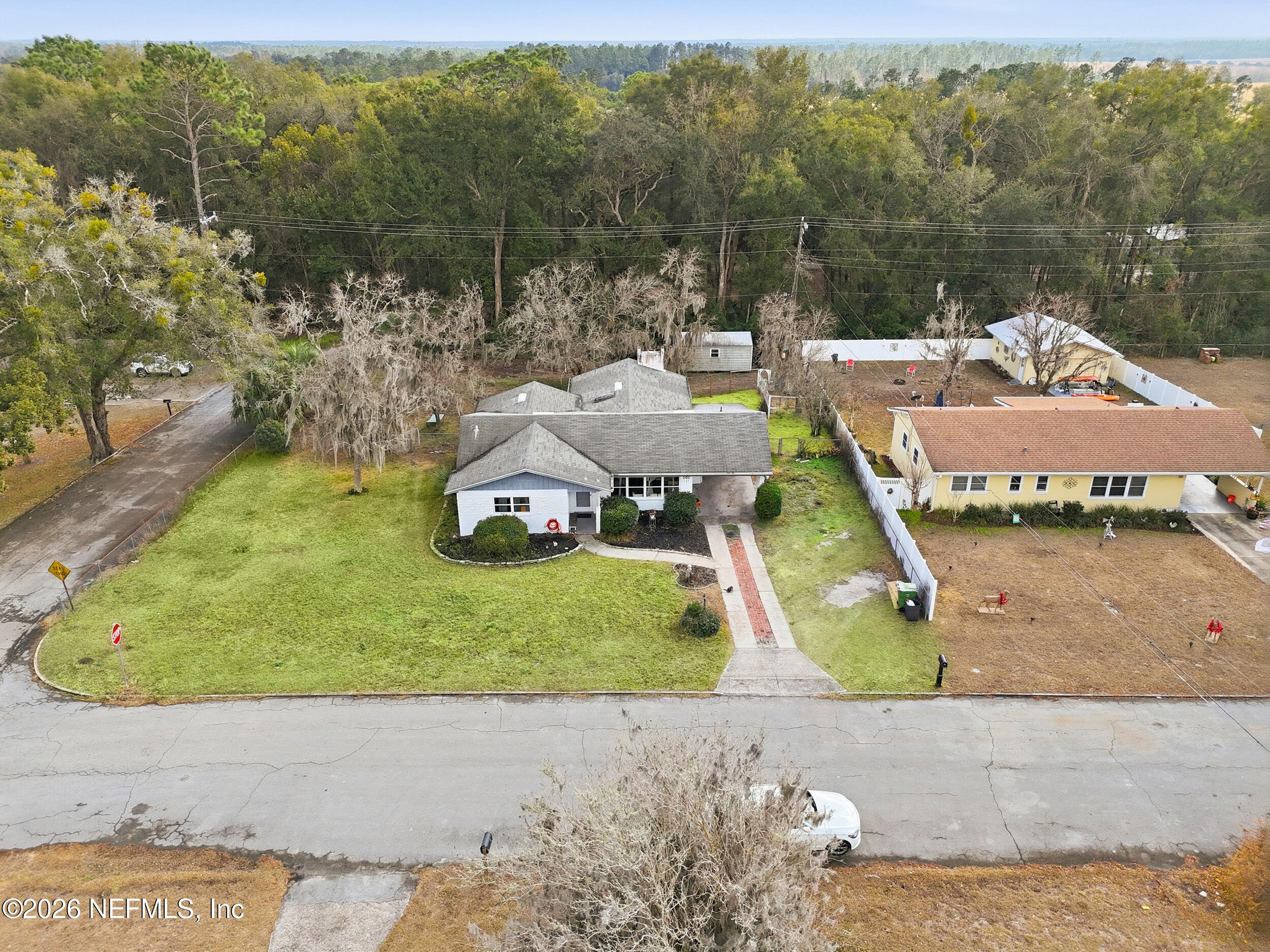 101 Cedar Street Palatka, FL 32177 - Photo 36 of 43 a view of a house with a yard and a car park side