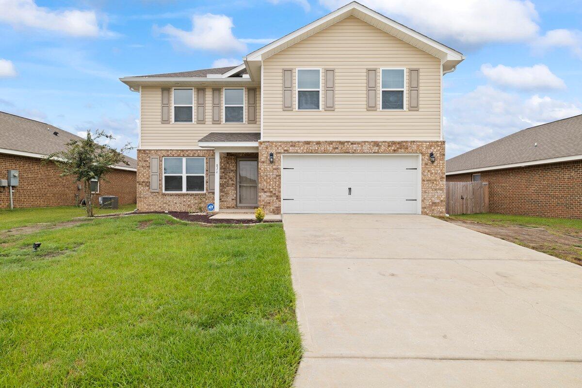 a view of a house with a yard